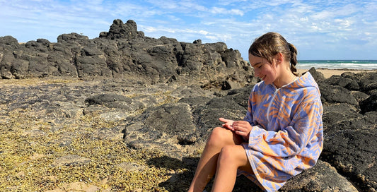 exploring rockpools on the beach