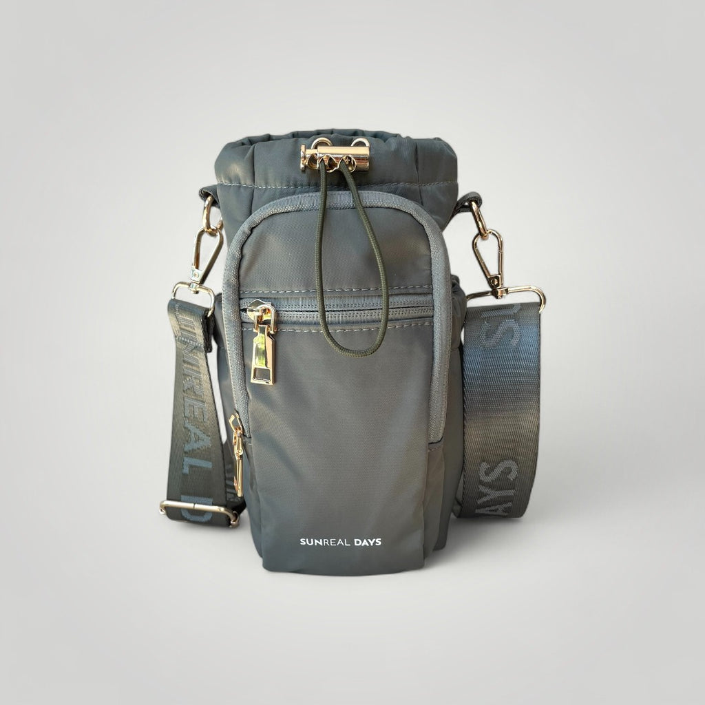 Khaki green water bottle carry bag with gold accents and 'Sunreal Days' branding. Zipped pockets to hold phone and keys.