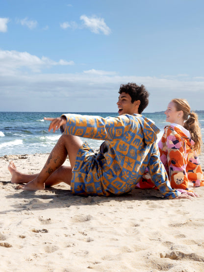 friends wearing printed hooded swim jacket 