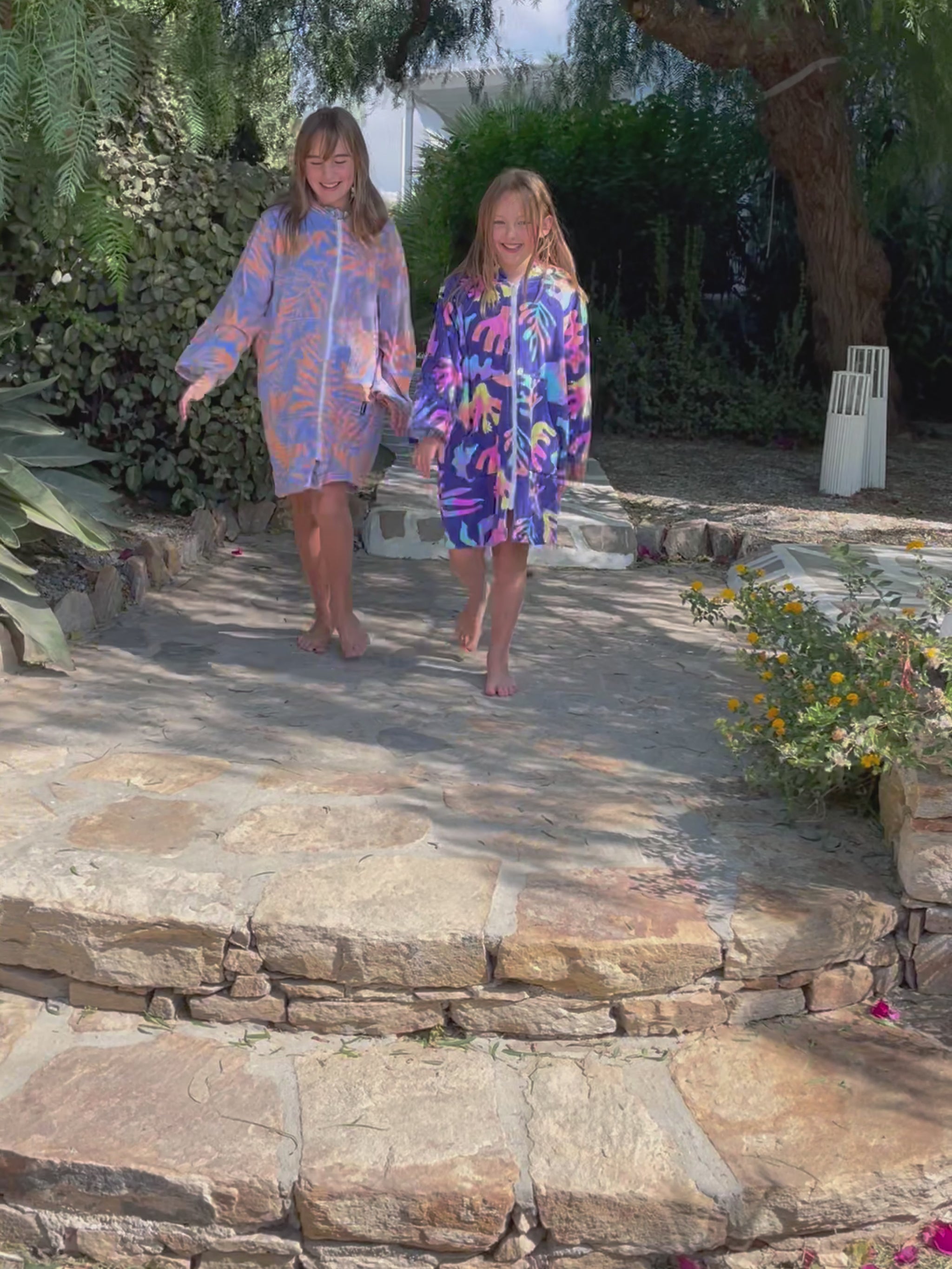 Colourful towelling robes suitable for the pool, beach and bath